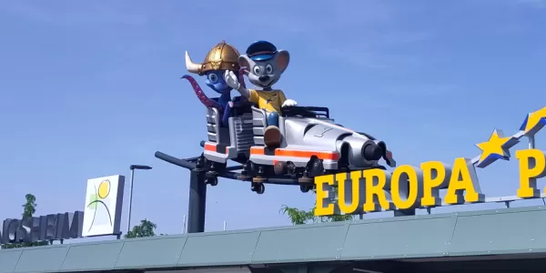 Decoration that says "Europa park" and two animal statues on a rollercoaster