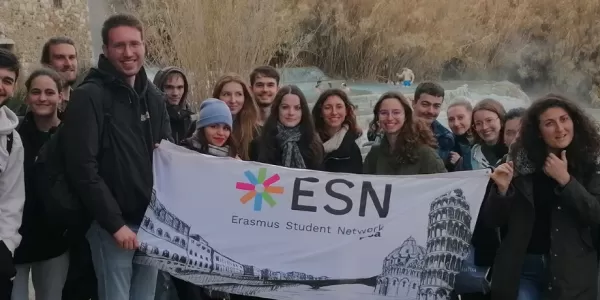 Group of people in front of the falls with the ESN flag