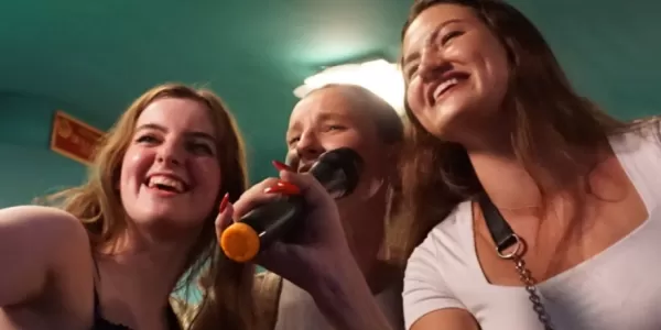Erasmus students singing a song at Karoke