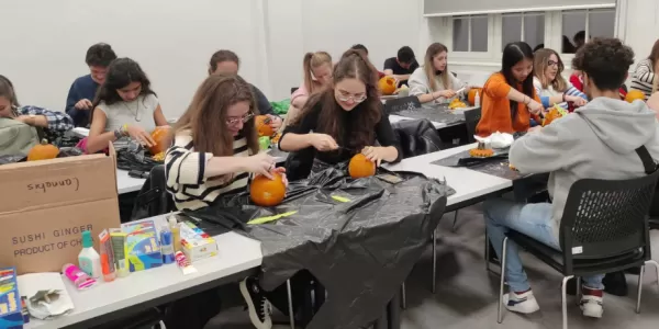 Erasmus Students carving pumpkins