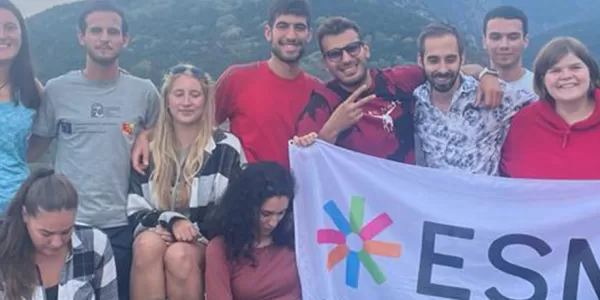 Erasmus studend with ESN flag in a trip to Asenovgrad