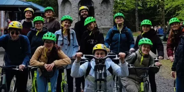 Group phto before riding scooters in the forest