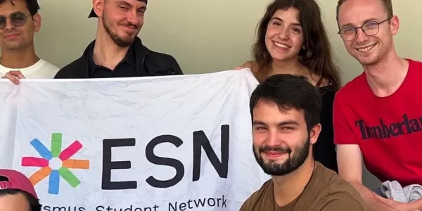 ESN team and students with the ESN flag