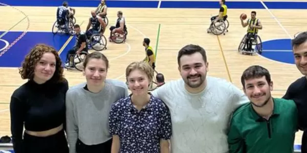 A picture of Erasmus Students and ESN'ers watching Wheelchair Basketball Match