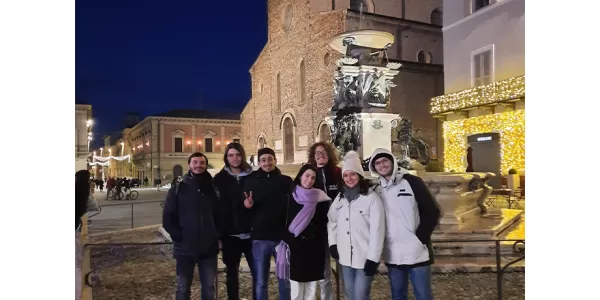 Esners taking a group photo in the main street of the city of Faenza. Behind the Duomo of Faenza