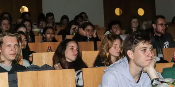 Group of international students watching a movie.