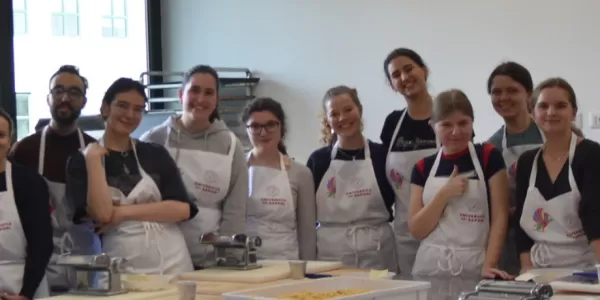 All of the chef students with the pasta teacher