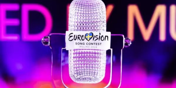 Picture of the cristal trophy of the winner of Eurovision 2024 with a background that says "United by music"