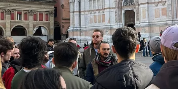 Group listening to tour guide in Bologna