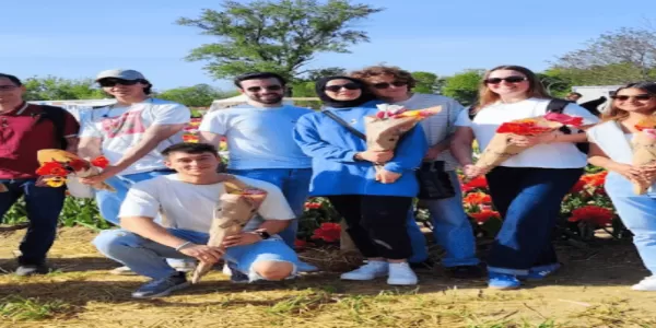 a group of people holding tulips