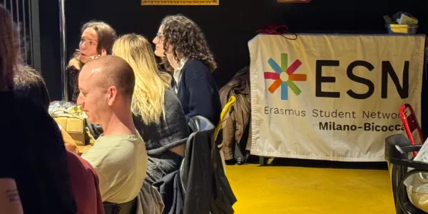 Participants at their tables learning Italian gestures