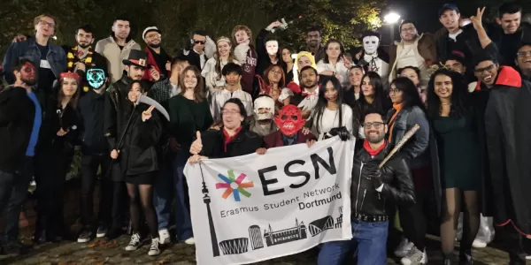 participants in costumes holding the ESN Dortmund flag