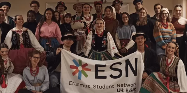 Group of international students and students in traditional Polish clothes