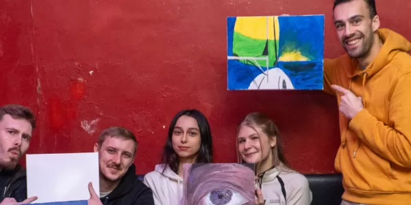 Participants with their paintings