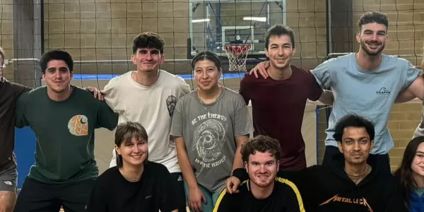 Group picture in front of the volleyball net