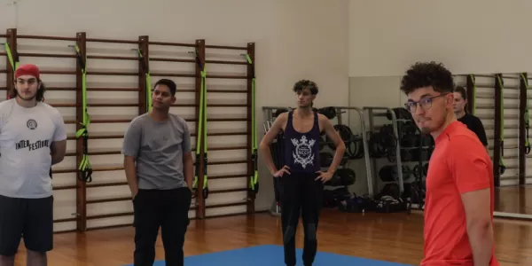 Group of international students listening to the self defense instructor.