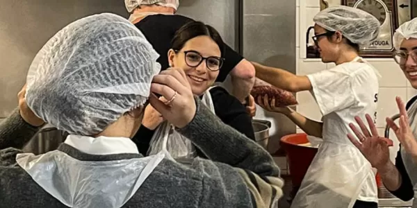 Group of international students volunteering in a canteen.