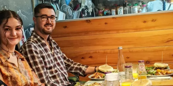 Photo group of international students having a vegan dinner.
