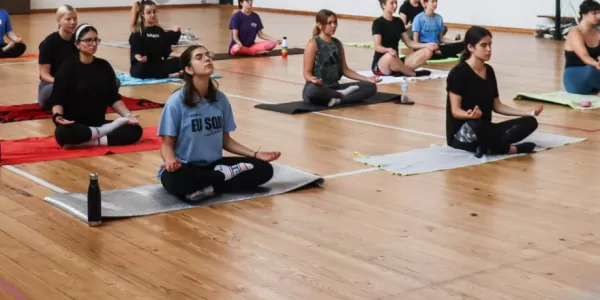 Group of international students having a yoga class.