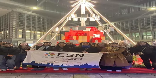 Group of international students holding ESN Milano IULM flag