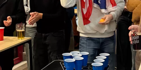 International students playing cup pong