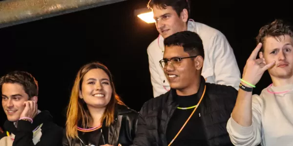 Photo group of international students at night.