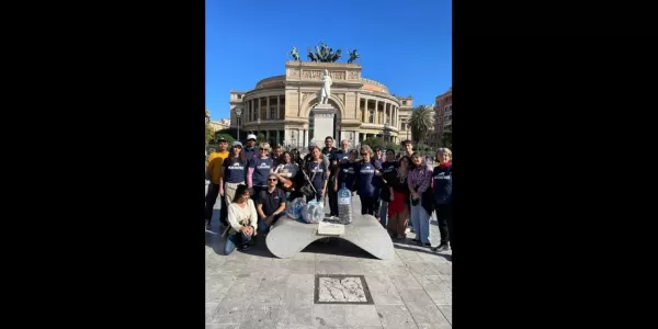 Volunteers with collected cigarette butts at the end of the event