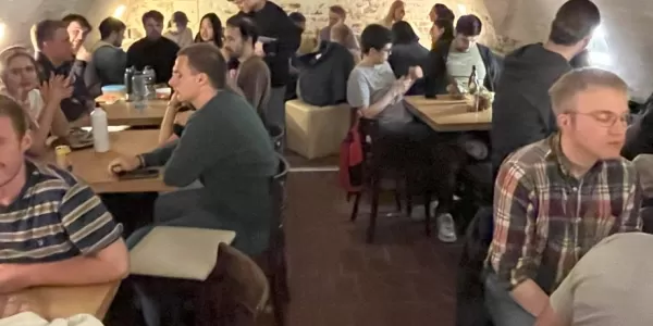 Participants enjoying food and company at our Länderabend.