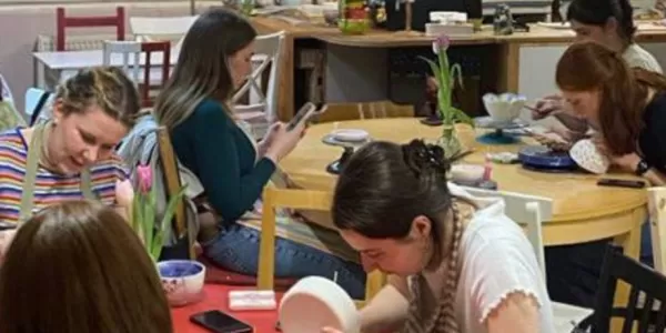 People painting clay