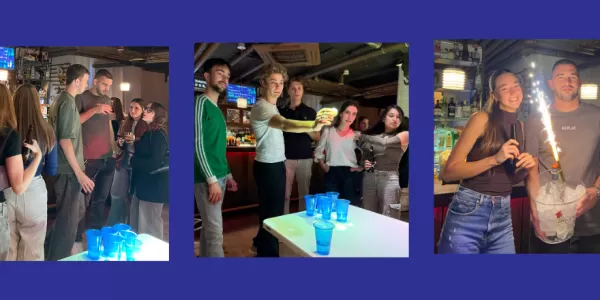 International students playing beer pong and exhibing the prize