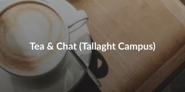 A cappuccino in a white cup on a wooden table with a spoon on the saucer. Text "Tea & Chat (Tallaght Campus)" is in the centre. ESN TU Dublin logo is on the right.