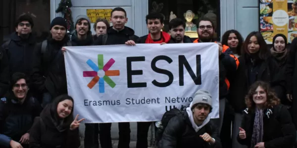 Students are standing with the flag.