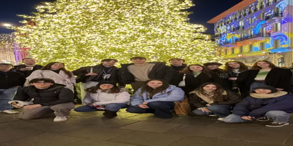 Group photo of the two sections by the Christmas tree in Lugano's main square.