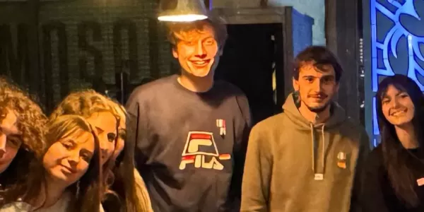 Group of students enjoying a relaxed evening of language practice