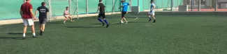 students playing football