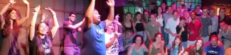 In the left, ESN coordinators dancing and teaching a reggaeton dance to Ludàlia users. In the right, a group photo with some coordinators and local Ludàlia users.