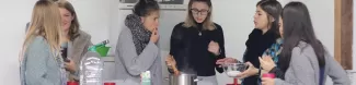 International students cooking vegan food together.