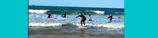 Local and international students surfing together