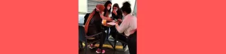 International students having a drink and speaking to each other during the activity