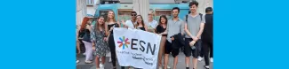 erasmus students with the ESN Milano-Bicocca flag 