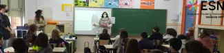 A class full of students with an Erasmus presenting and talking about her country