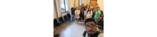 An international students takes a selfie with other students and ESNers