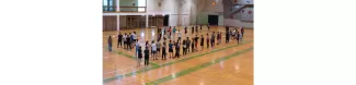 students playing frisbee in the gym