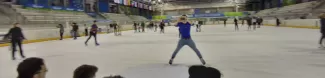 an erasmus is ice skating and taking pictures