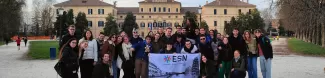 The group of international students who partecipated standing in front of Palazzo Ducale del Giardino in Parma, with the flag of ESN Pisa in the front
