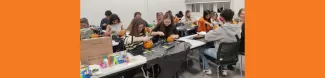 Erasmus Students carving pumpkins