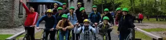 Group phto before riding scooters in the forest