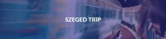 There's a train faded behind ESN's dark blue colour, Szeged trip is readable in the middle of the picture.