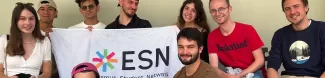 ESN team and students with the ESN flag