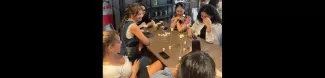 Group of international students playing a game together with noodles and marshmallows